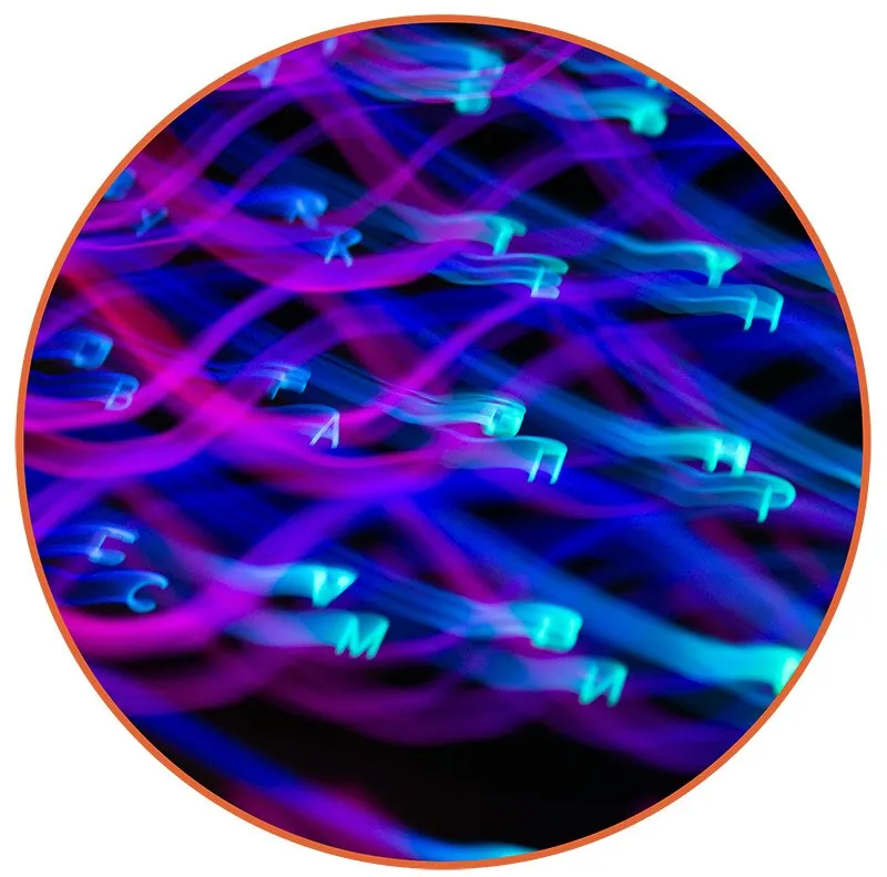 Blurred neon letters on a dark background with swirling blue and pink light trails, creating a dynamic, futuristic, and abstract mood.